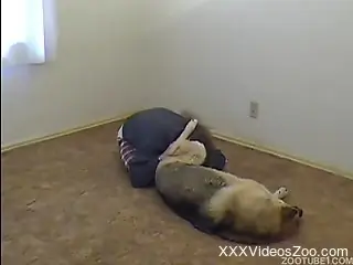 Tatted-up dude pounding his beloved pooch on the floor
