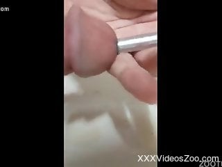 Dude inserts long worm up his dick for spicy action