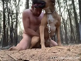 Muscular dude fucking submissive animal outside