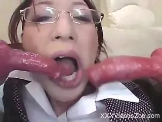 Japanese babe gets cum on face from two big dog dicks