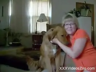 Nasty mature is licking furry cunt of her dog