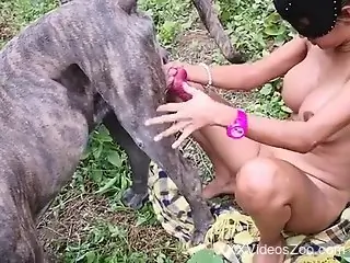 Naked Latina slut plays with her dog in nature scenes