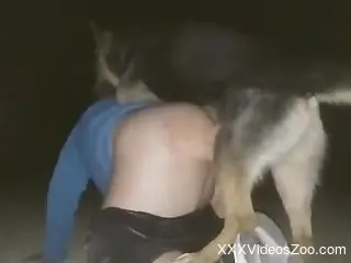 dog deep fucks half-naked man and comes on his ass