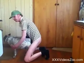 Half-naked amateur dude fucks his dog in the ass during a cam show