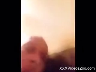 Curious man plays with the dog in homemade sexual perversions