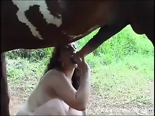 Nude mature throats the horse's huge penis until the last drops
