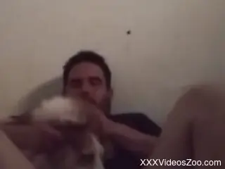 Naked man gets taped at home playing sexual games with his dog